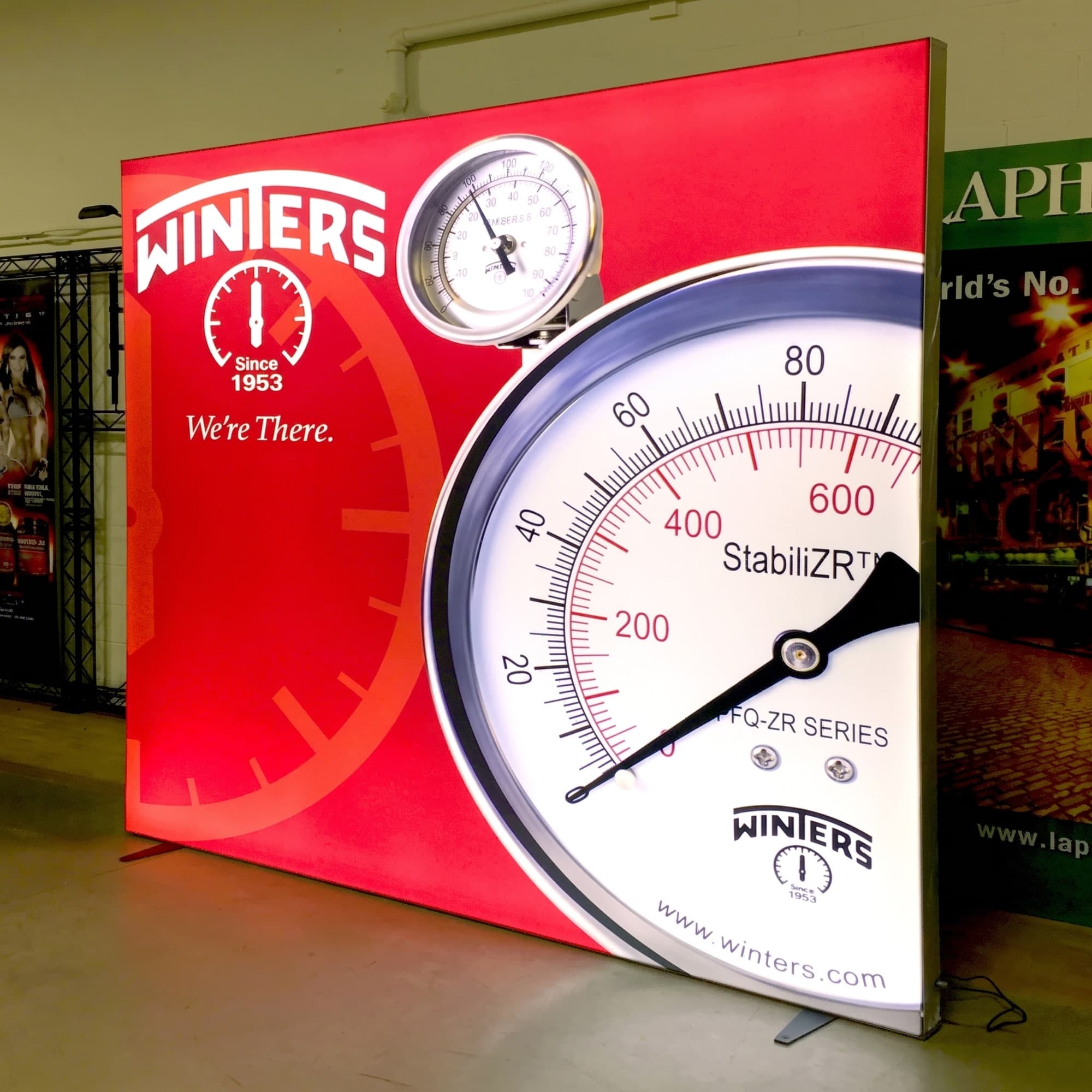 Backlit lightbox exhibit wall with fabric graphics
