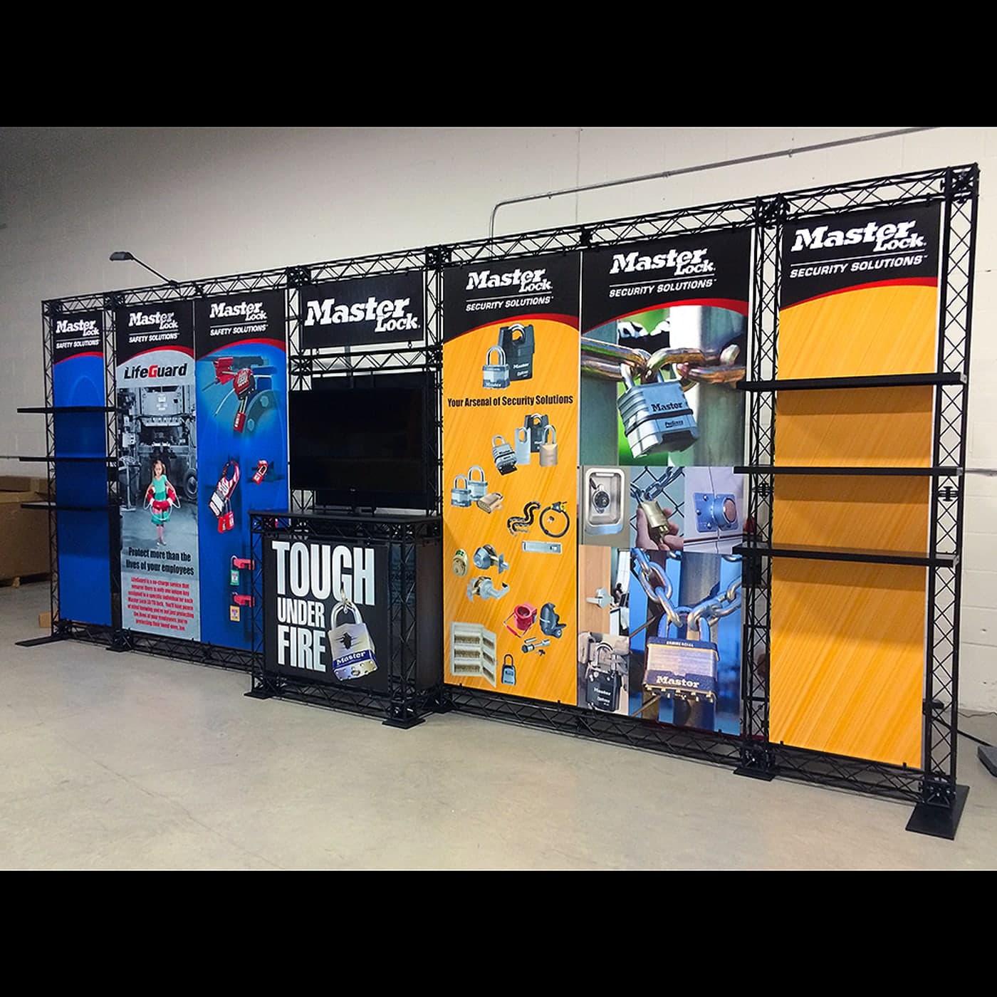CrossWire truss exhibit with shelving, monitor and counter built for Master Lock